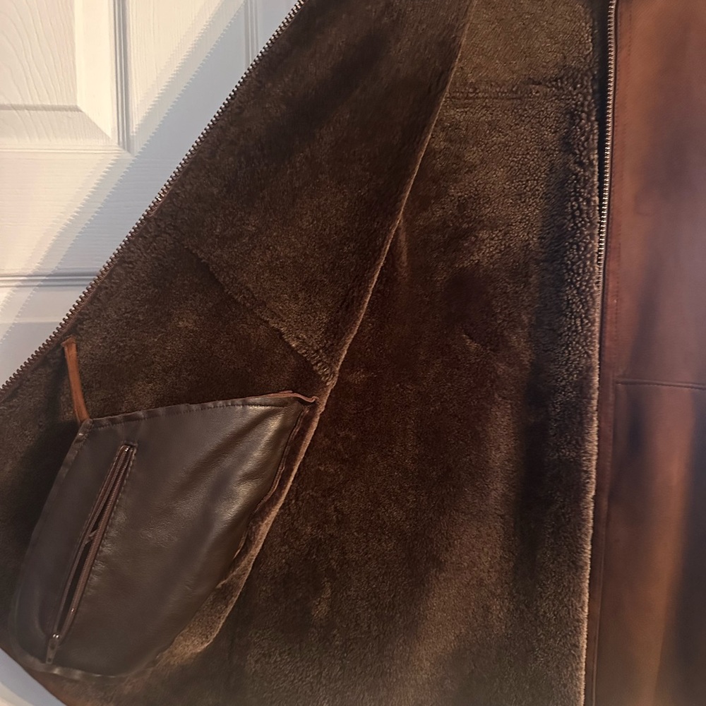 Selling a men’s brown suede vest www.rafaelshearling.com